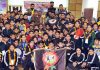 Medal winners posing for group photograph.