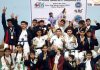 Medal winners posing for group photograph.