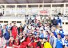Winner team receiving title trophy of the Cricket League organized by Army at sports stadium Doda.