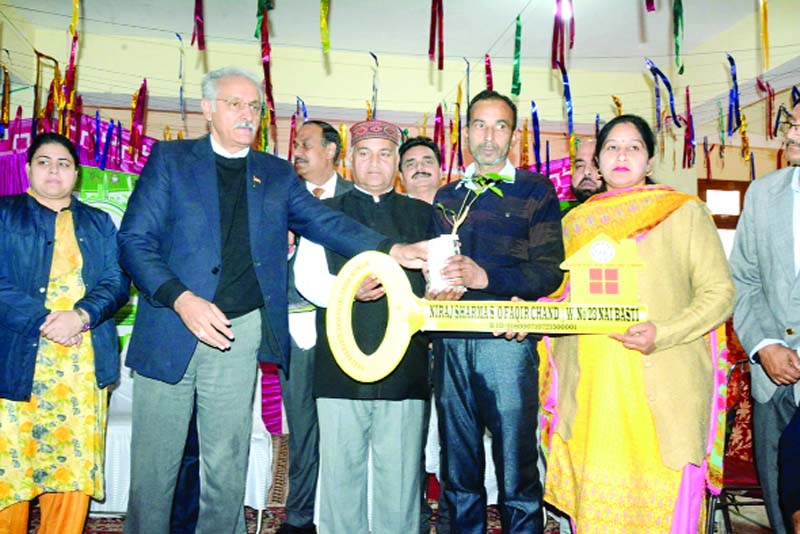 MD J&K Housing Board Arvind Kotwal and Corporator Ward Number 51 JMC Raj Kumar handing over symbolic keys and plants among the beneficiaries under PMAY Urban Mission. MD J&K Housing Board Arvind Kotwal and Corporator Ward Number 51 JMC Raj Kumar handing over symbolic keys and plants among the beneficiaries under PMAY Urban Mission.