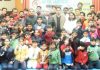 Medal winners and dignitaries posing for group photograph.
