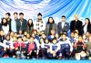 Orphanage kids posing along with dignitaries and officials during a talk show in Jammu.
