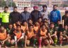 Winners posing along with officials during Football Tournament at Mini Stadium Parade in Jammu.