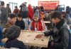 Players in action during Carrom Tournament in Srinagar.