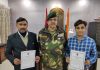 NCC employees displaying Certificates after receiving commendation card.