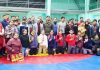 Winners of Wrestling competition posing along with officials on JU Campus in Jammu.