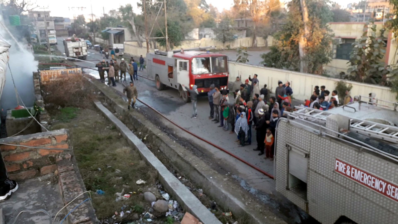 Fire tenders controlling blaze as biscuit factory catches fire in Kathua on Friday. -Excelsior/Pardeep Fire tenders controlling blaze as biscuit factory catches fire in Kathua on Friday. -Excelsior/Pardeep