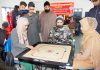 Players in action during Carrom Championship in Srinagar.