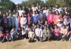 Winners of various athletics events posing with Regional Director, RBI Jammu, Thomas Mathew at RBI Colony grounds in Jammu.