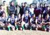 Footballers posing for a group photograph alongwith officials in Jammu on Friday.