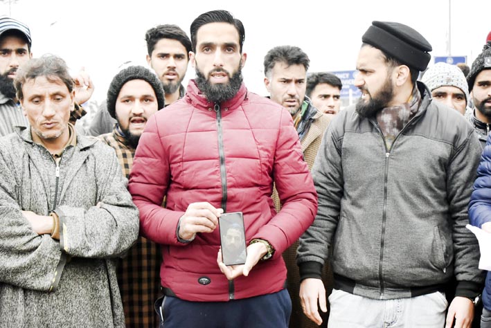 Family members and relatives of teenager protesting outside SKIMS Soura. -Excelsior/Shakeel Family members and relatives of teenager protesting outside SKIMS Soura. -Excelsior/Shakeel