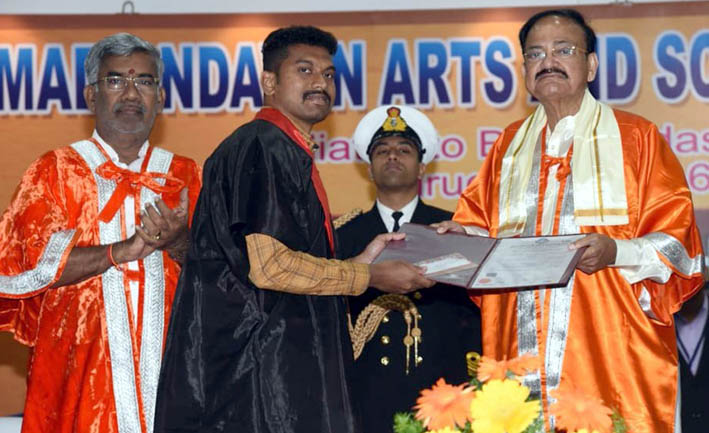 Vice President M Venkaiah Naidu presenting dgree certificate to a student at the 21st Convocation of Srimad Andavan Arts and Science College (Autonomous), in Tiruchirapalli on Saturday. (UNI) Vice President M Venkaiah Naidu presenting dgree certificate to a student at the 21st Convocation of Srimad Andavan Arts and Science College (Autonomous), in Tiruchirapalli on Saturday. (UNI)