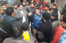 PCC leader, Raman Bhalla interacting with people in Gandhi Nagar on Saturday. PCC leader, Raman Bhalla interacting with people in Gandhi Nagar on Saturday.