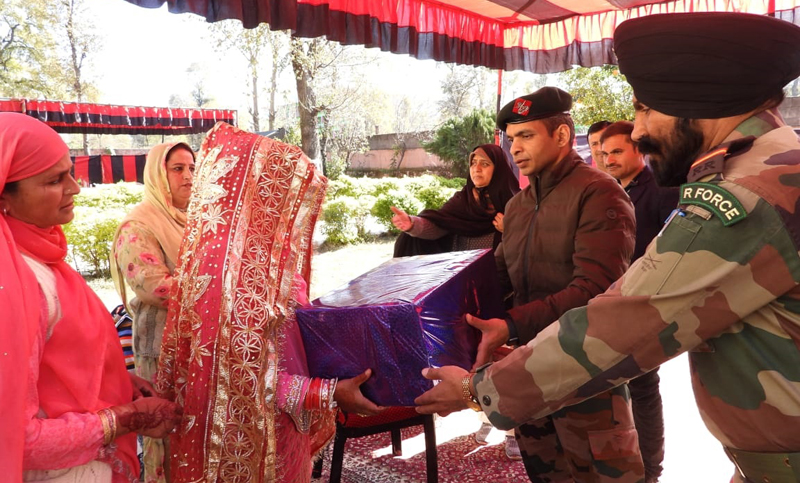 Army officers offering a gift to a poor girl during her marriage at Mendhar. Army officers offering a gift to a poor girl during her marriage at Mendhar.