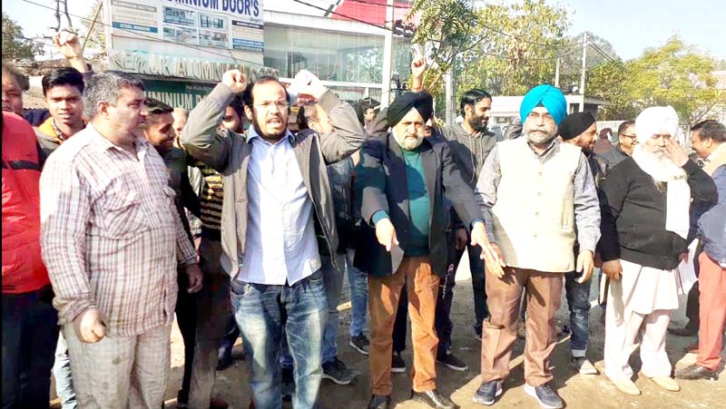Members of Digiana Highway Market Association during a protest at Jammu on Friday. Members of Digiana Highway Market Association during a protest at Jammu on Friday.