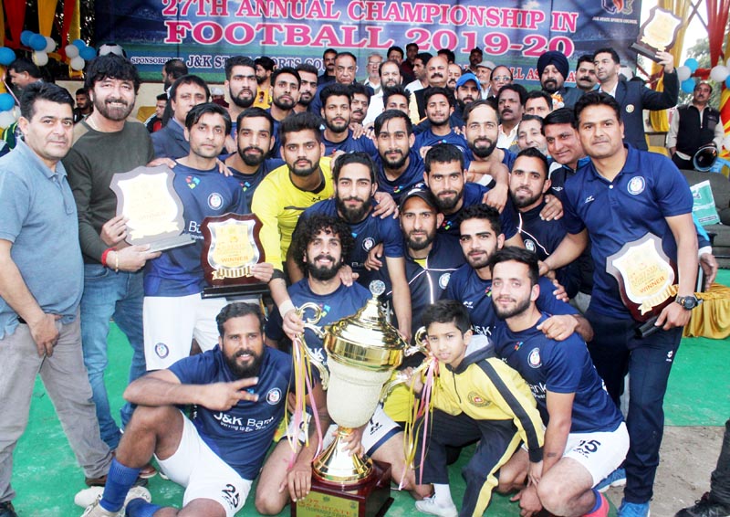 Jubilant players of JK Bank team posing along with dignitaries and officials after receiving winner's trophy at GGM Science College Hostel ground in Jammu. Jubilant players of JK Bank team posing along with dignitaries and officials after receiving winner's trophy at GGM Science College Hostel ground in Jammu.