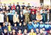 Participants of the J&K Athletics Championship posing along with chief guest at JU grounds in Jammu on Thursday.