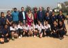Volleyball women team posing along with dignitaries and officials at GCW Gandhi Nagar in Jammu.