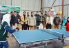 Players in action during Table Tennis match of Rolling Championship in Shopian.