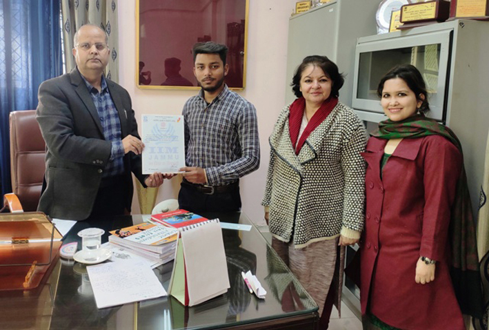 Principal MAM College, GS Rakhwal felicitating the student for securing first position in the singing competition in Jammu. Principal MAM College, GS Rakhwal felicitating the student for securing first position in the singing competition in Jammu.