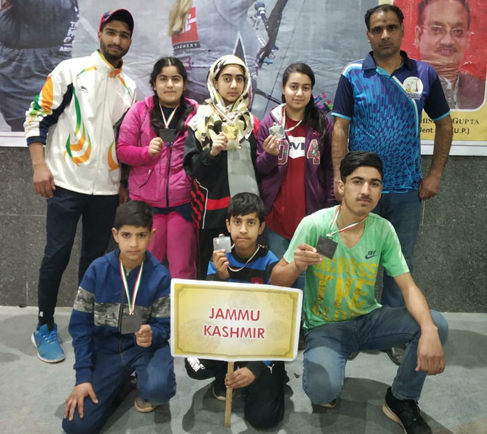 Medal winners in Indoor Field Archery posing along with officials at Agra. Medal winners in Indoor Field Archery posing along with officials at Agra.