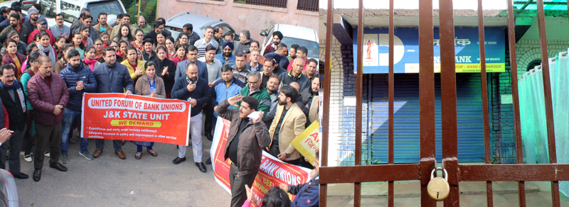 Bank employees protesting in Jammu (L) and locked gate of Dena Bank at Srinagar (R). -Excelsior/Rakesh/UNI Bank employees protesting in Jammu (L) and locked gate of Dena Bank at Srinagar (R). -Excelsior/Rakesh/UNI