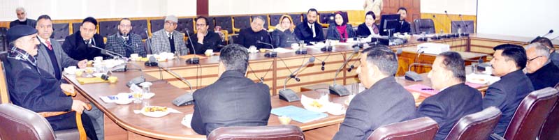 Justice Ali Mohd Magray chairing a meeting at Srinagar on Thursday. Justice Ali Mohd Magray chairing a meeting at Srinagar on Thursday.