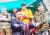 Winner being presented a trophy by the Army Officer in Kargil. -Excelsior/Basharat Ladakhi