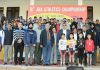 Winners of J&K Athletics Championship posing along with chief guest at JU grounds, Jammu on Friday.