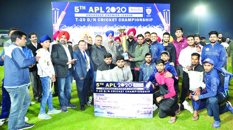 Jubilant DDCA XI players posing along with dignitaries and officials after receiving winner’s trophy in Amritsar. Jubilant DDCA XI players posing along with dignitaries and officials after receiving winner’s trophy in Amritsar.