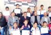 Winners of Reasi Chess Championship posing alongwith dignitaries and officials at Panthal.