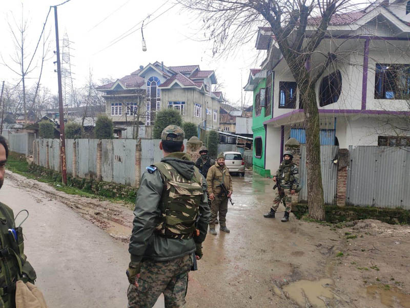 Security personnel guard a house during NIA raids in Pattan on Saturday. —Excelsior/Aabid Nabi Security personnel guard a house during NIA raids in Pattan on Saturday. —Excelsior/Aabid Nabi