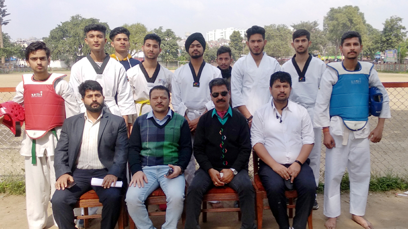 Selected team of Teakwondo posing a group photograph with dignitaries of the tournament in Jammu. Selected team of Teakwondo posing a group photograph with dignitaries of the tournament in Jammu.