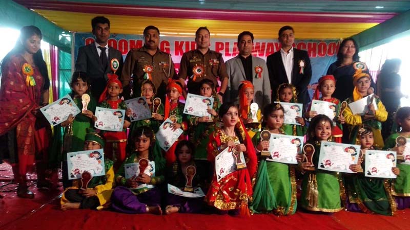 Students of Grooming Kids posing for a group photograph with dignitaries during Annual Day function. Students of Grooming Kids posing for a group photograph with dignitaries during Annual Day function.