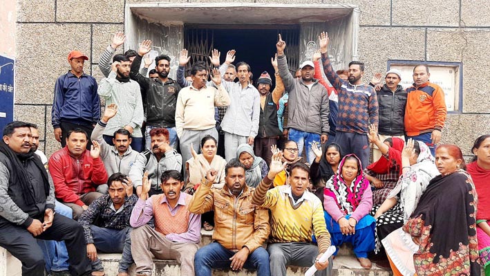 Safai Karamcharis protesting in front of Municipal Committee Udhampur on Saturday. Safai Karamcharis protesting in front of Municipal Committee Udhampur on Saturday.