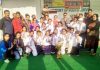 Winners of Under-25 Girls Cricket Tournament posing along with chief guest and other dignitaries in Samba.