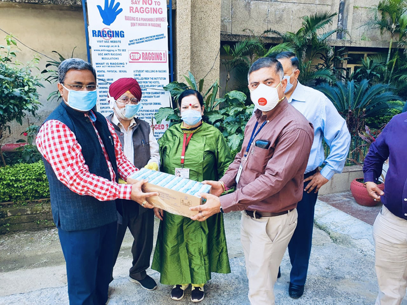 CTF-J president Neeraj Anand and Attar Singh, C&F for Dabur India handing over packed juices to Principal GMC Jammu Dr Sunanda Raina and Administrator Amit Sharma. CTF-J president Neeraj Anand and Attar Singh, C&F for Dabur India handing over packed juices to Principal GMC Jammu Dr Sunanda Raina and Administrator Amit Sharma.