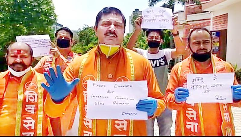 Shiv Sena leaders staging protest outside their party office in Jammu. Shiv Sena leaders staging protest outside their party office in Jammu.
