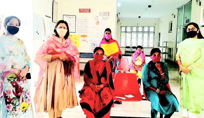 Rekha Mahajan, Secretary, BJP J&K during distribution of face covers among the parents visiting PHC Trikuta Nagar Jammu. Rekha Mahajan, Secretary, BJP J&K during distribution of face covers among the parents visiting PHC Trikuta Nagar Jammu.