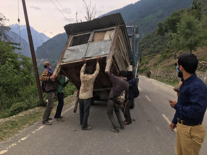 Labourers removing illegal structure. — Excelsior/Tilak Raj Labourers removing illegal structure. — Excelsior/Tilak Raj