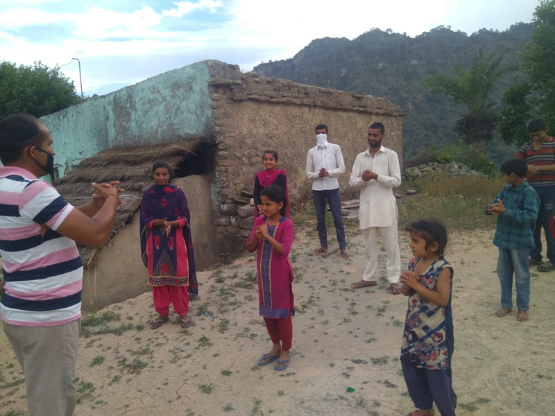 A PLV of DLSA Rajouri demonstrating hand washing technique to children. A PLV of DLSA Rajouri demonstrating hand washing technique to children.