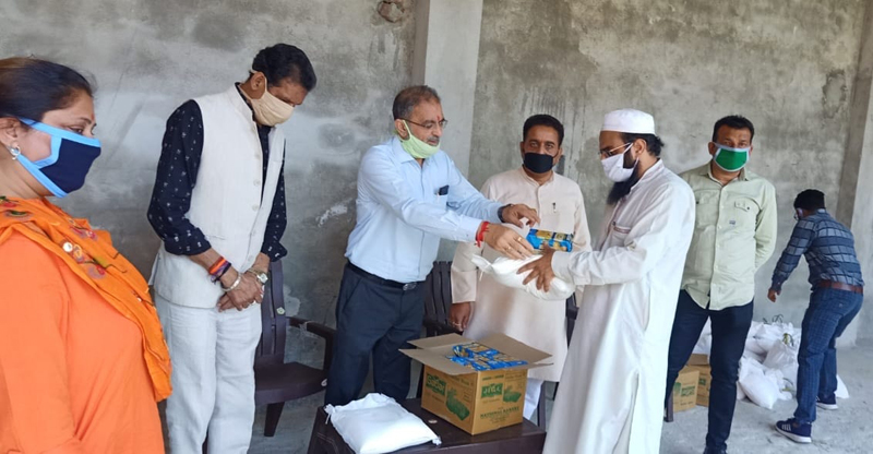 Former Dy CM Kavinder Gupta distributing ration in Masjid Mohalla Bahu on Thursday. Former Dy CM Kavinder Gupta distributing ration in Masjid Mohalla Bahu on Thursday.