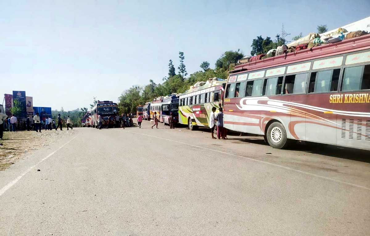 Buses carrying labourers heading towards Katra Railway Station on Monday. -Excelsior/ Ramesh Mengi Buses carrying labourers heading towards Katra Railway Station on Monday. -Excelsior/ Ramesh Mengi