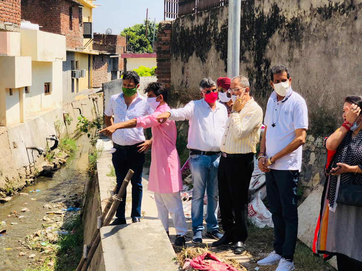 Former Deputy CM, Kavinder Gupta kick starting construction of deep drain in Trikuta Nagar on Monday. Former Deputy CM, Kavinder Gupta kick starting construction of deep drain in Trikuta Nagar on Monday.