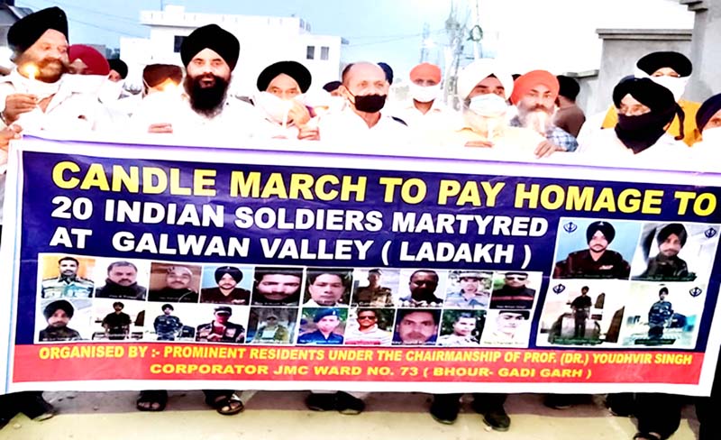 People of Sikh community during a candle march in Gadigarh area of Jammu. People of Sikh community during a candle march in Gadigarh area of Jammu.