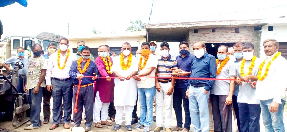 Former Minister and senior BJP leader C P Ganga kick starting blacktopping of road at Palli on Friday. -Excelsior/Gautam Former Minister and senior BJP leader C P Ganga kick starting blacktopping of road at Palli on Friday. -Excelsior/Gautam
