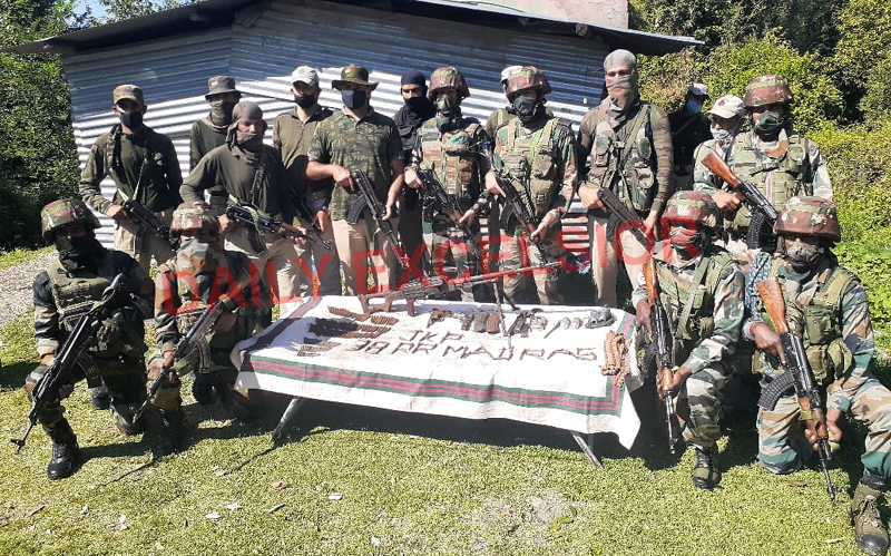Security personnel pose with arms and ammunition recovered in Rajouri on Wednesday. -Excelsior/Gafoor Bhat Security personnel pose with arms and ammunition recovered in Rajouri on Wednesday. -Excelsior/Gafoor Bhat
