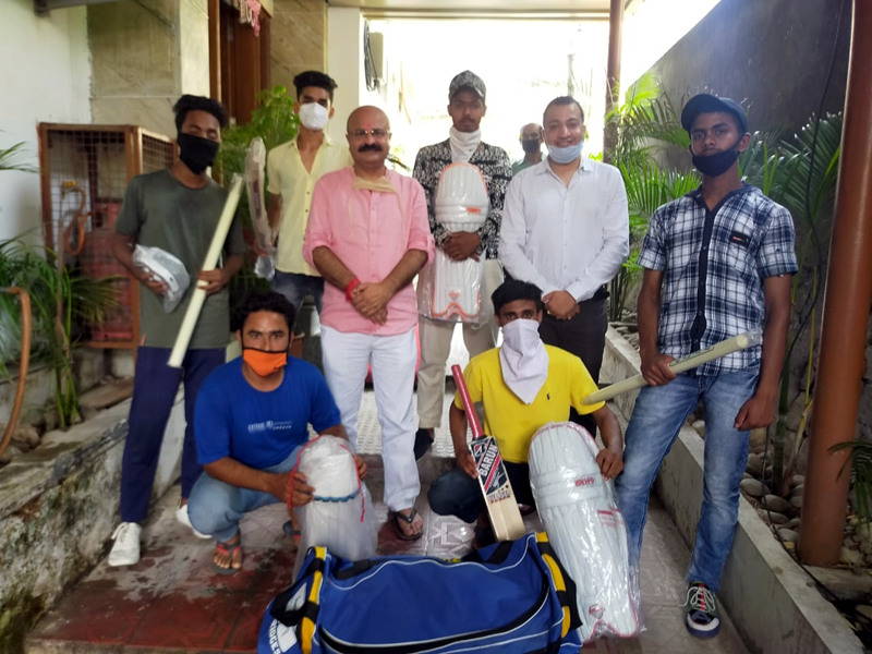 J&K BJP Vice President Yudhvir Sethi presenting cricket kit to young players. J&K BJP Vice President Yudhvir Sethi presenting cricket kit to young players.