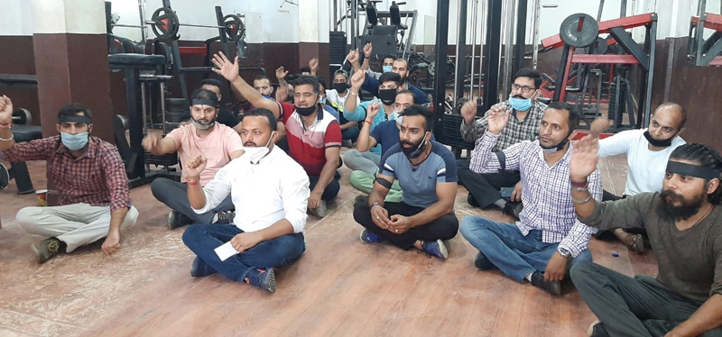 Proprietors of Health Clubs raising slogans during protest. Proprietors of Health Clubs raising slogans during protest.