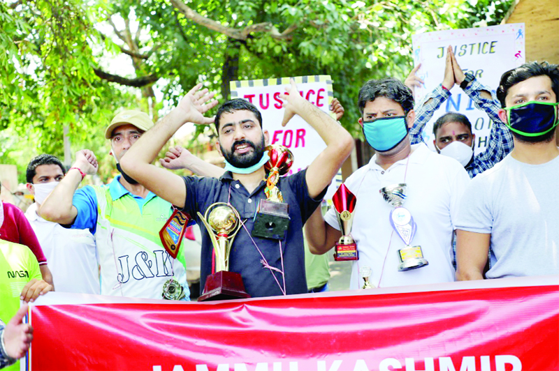 JKAP members raising slogans during protest at Jammu on Thursday. JKAP members raising slogans during protest at Jammu on Thursday.